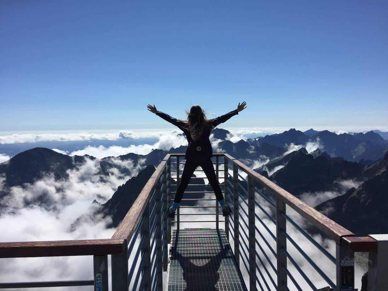 self-improvement tips: women standing over mountains